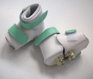 A prototype of baby shoes used to correct foot curvature.